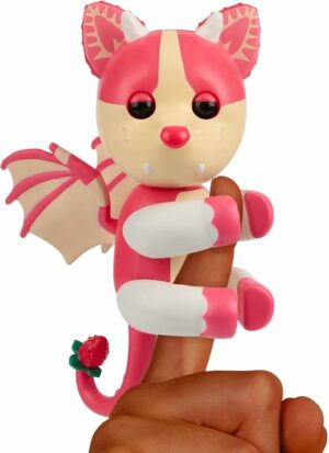 YOUR FAVORITE GAME COMES TO LIFE. Adopt Me fans can now collect and care for their favorite pets in real life. This Adopt Me!: Strawberry Shortcake Bat Dragon comes to life on your finger. INTERACTIVE PET WITH 40+ SOUNDS AND REACTIONS. Hear your legendary pet coo, giggle and even give you a kiss. Your touch brings your pet to life with a moving head, blinking eyes and so many cute sounds. CARE FOR YOUR PET IRL. Care for your pet like you would in the game. Each pet responds to your touch with sensors on their head and mouth. Pet them to show your love. Feed them, kiss them, and even play peek-a-boo. They also have motion sensors that detect when you flip them, shake them and rock them to sleep. THEY GO WHERE YOU GO. These pets love to go everywhere with you. Their portable size makes them easy to take with you. COLLECT BOTH ADORABLE PETS. Fans can collect both the Dog and the legendary Adopt Me!: Strawberry Shortcake Bat Dragon. Batteries included.